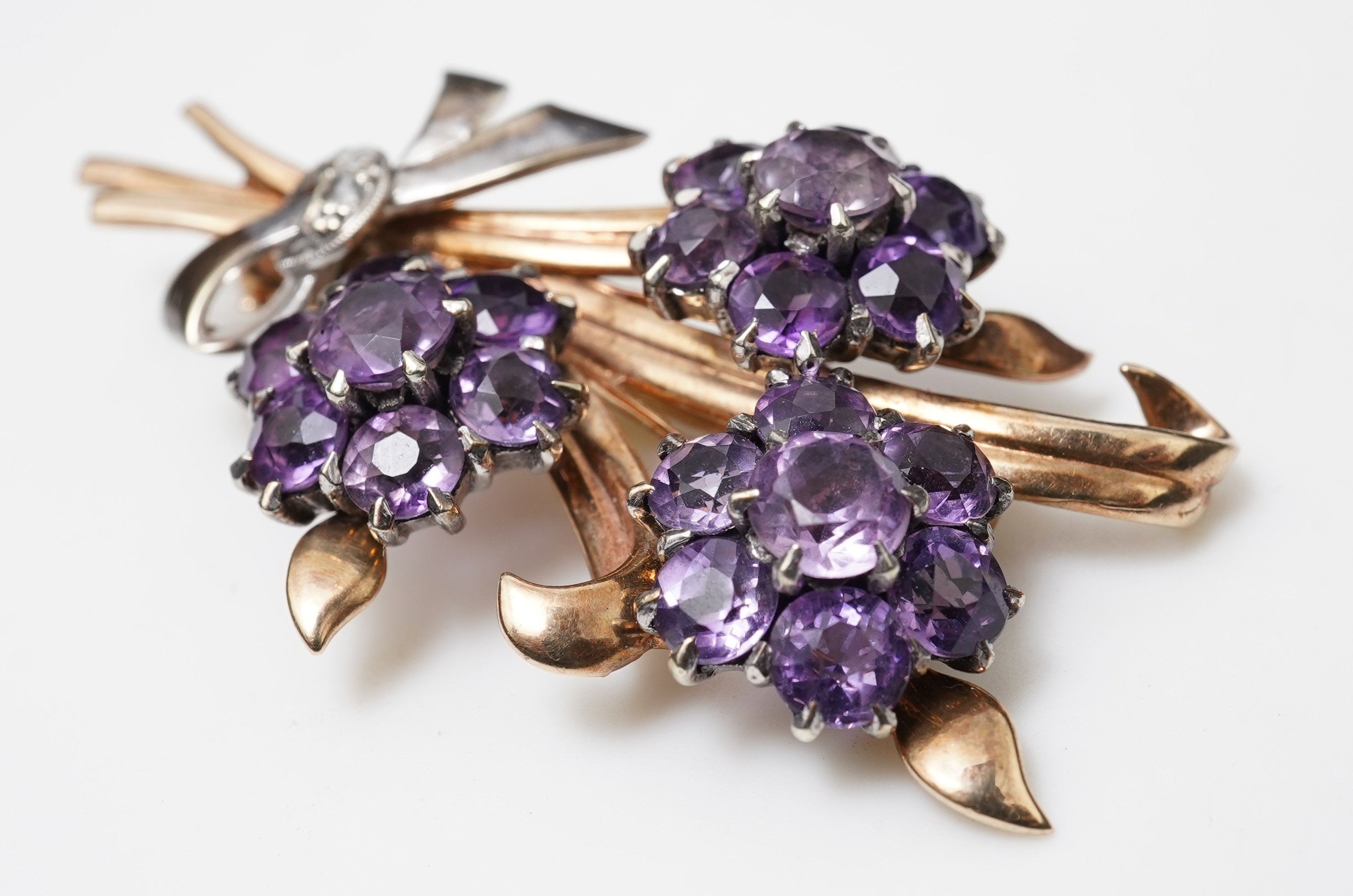 A Retro amethyst and diamond brooch, circa 1956